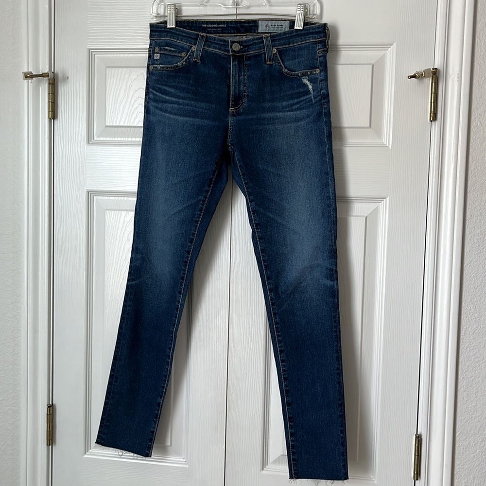 AG medium wash denim jeans. Size 28. Raw hem. The Legging Ankle. Soft, stretch